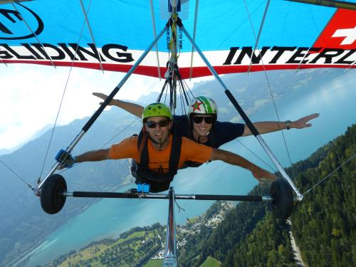 photo of two men hang gliding
