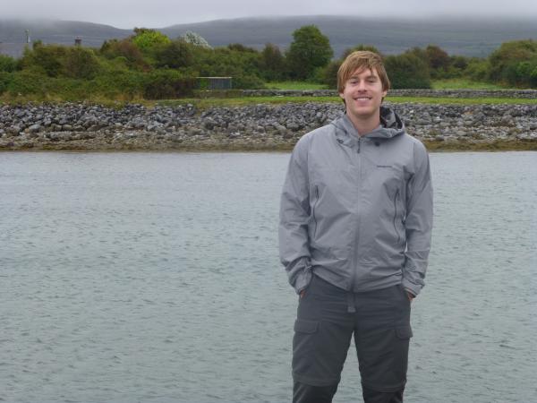 photo of a man in front of the ocean